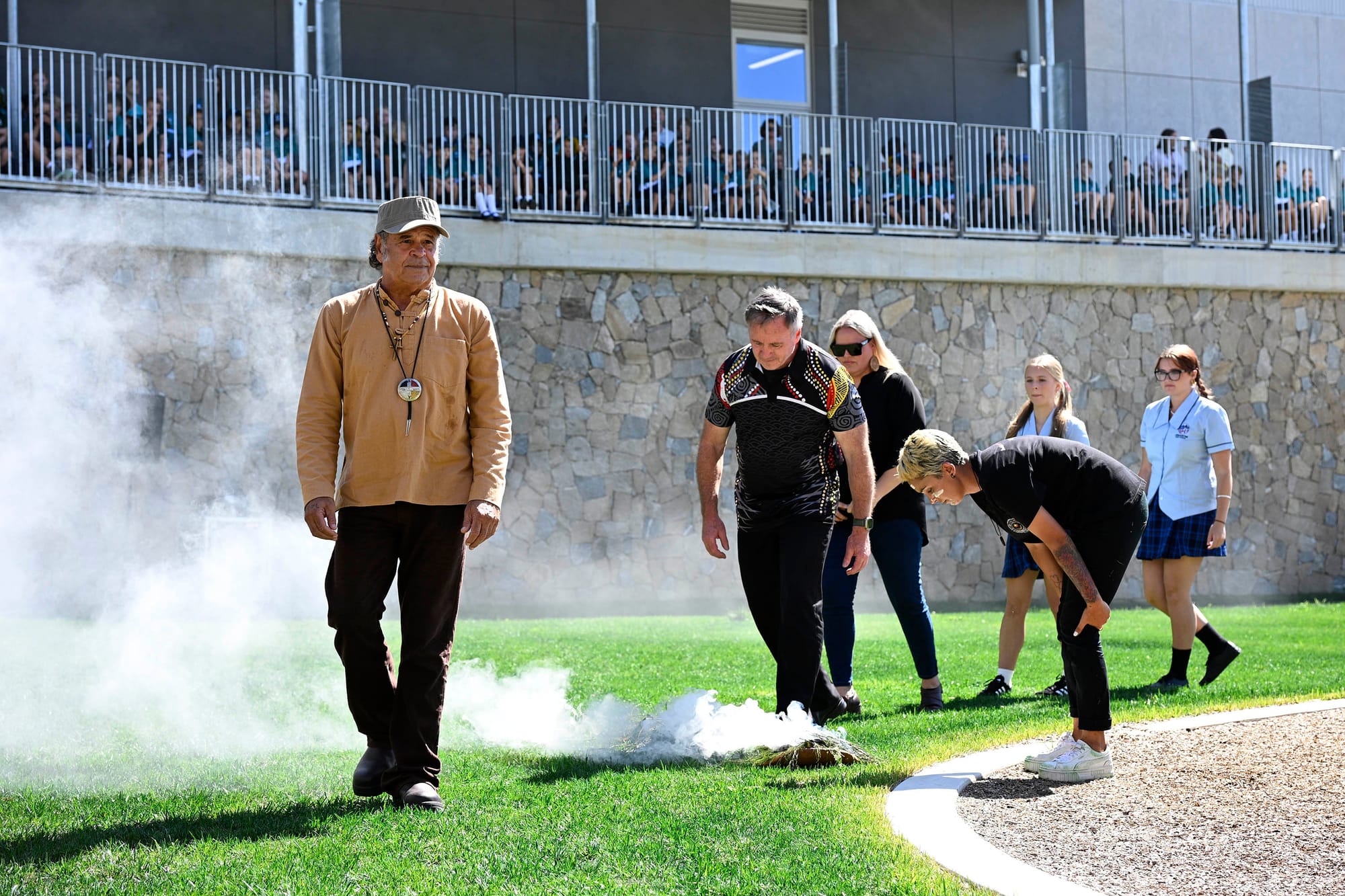 The Welcome to Country and smoking ceremony was led by Uncle BJ Cruse (left).