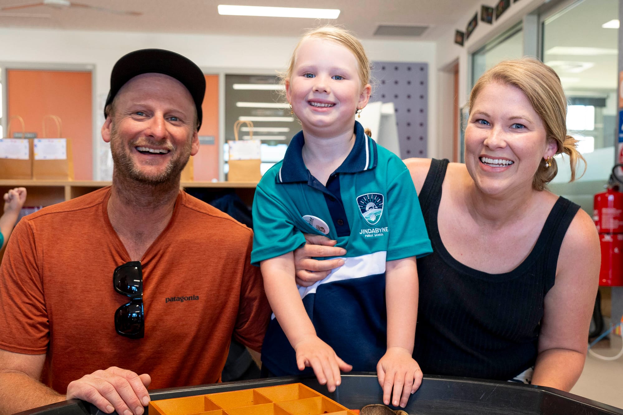 Adeline Jahns with parents Matt and Tegan on first day of kindergarten.