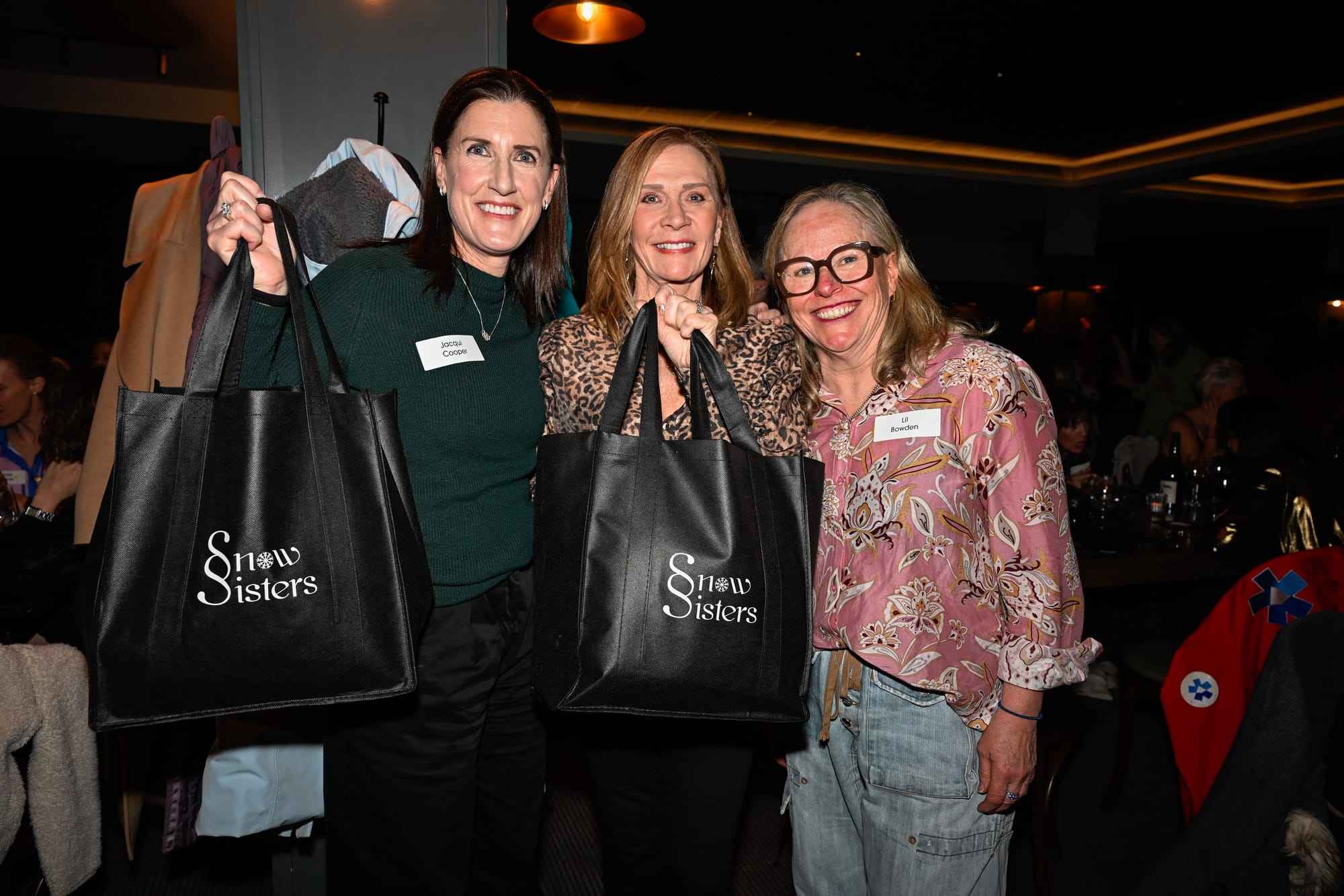PRESSIES: Showing off the giveaway bags for the night were  
(from left) Jacqui Cooper, Suzanne Rumble and Lil Bowden.