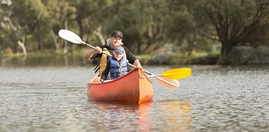 Family fun canoeing on Lake Crackenback