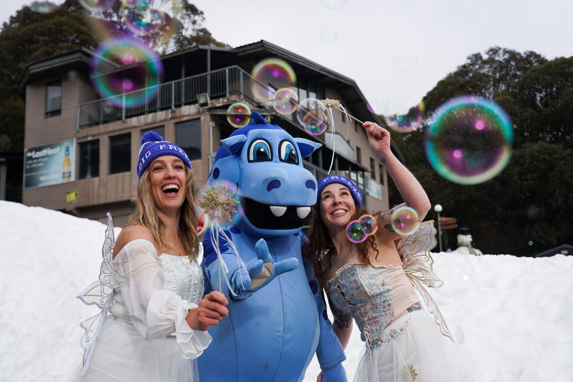 WINTER IS HERE: Pete the Snowdragon and some local princesses were at home in the snow, welcoming winter at Falls Creek on June 1.