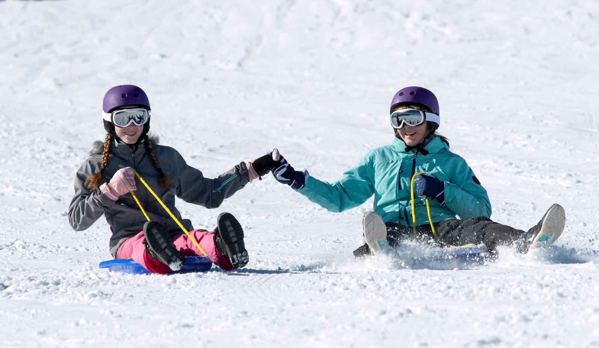 Sisters Abigail and Emmie from Tamworth riding the toboggans.