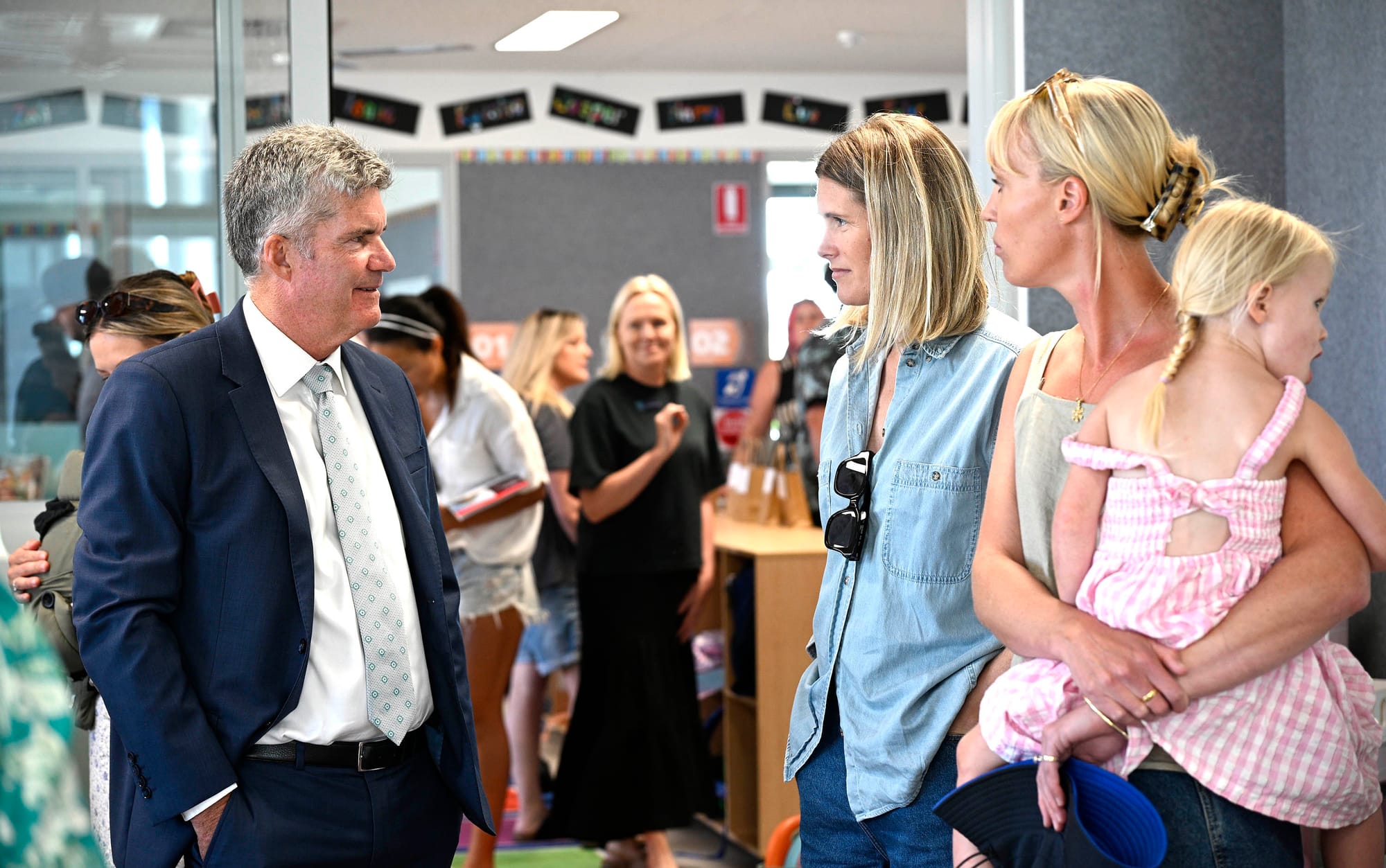 Steve Whan speaks with parents at the kindergarten.