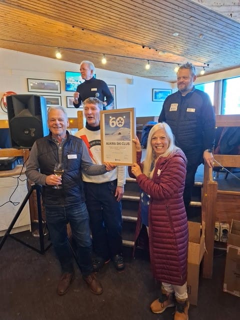 WE’RE PROUD: Members of the Alkira Ski Club were thrilled with their 60-year certificate.