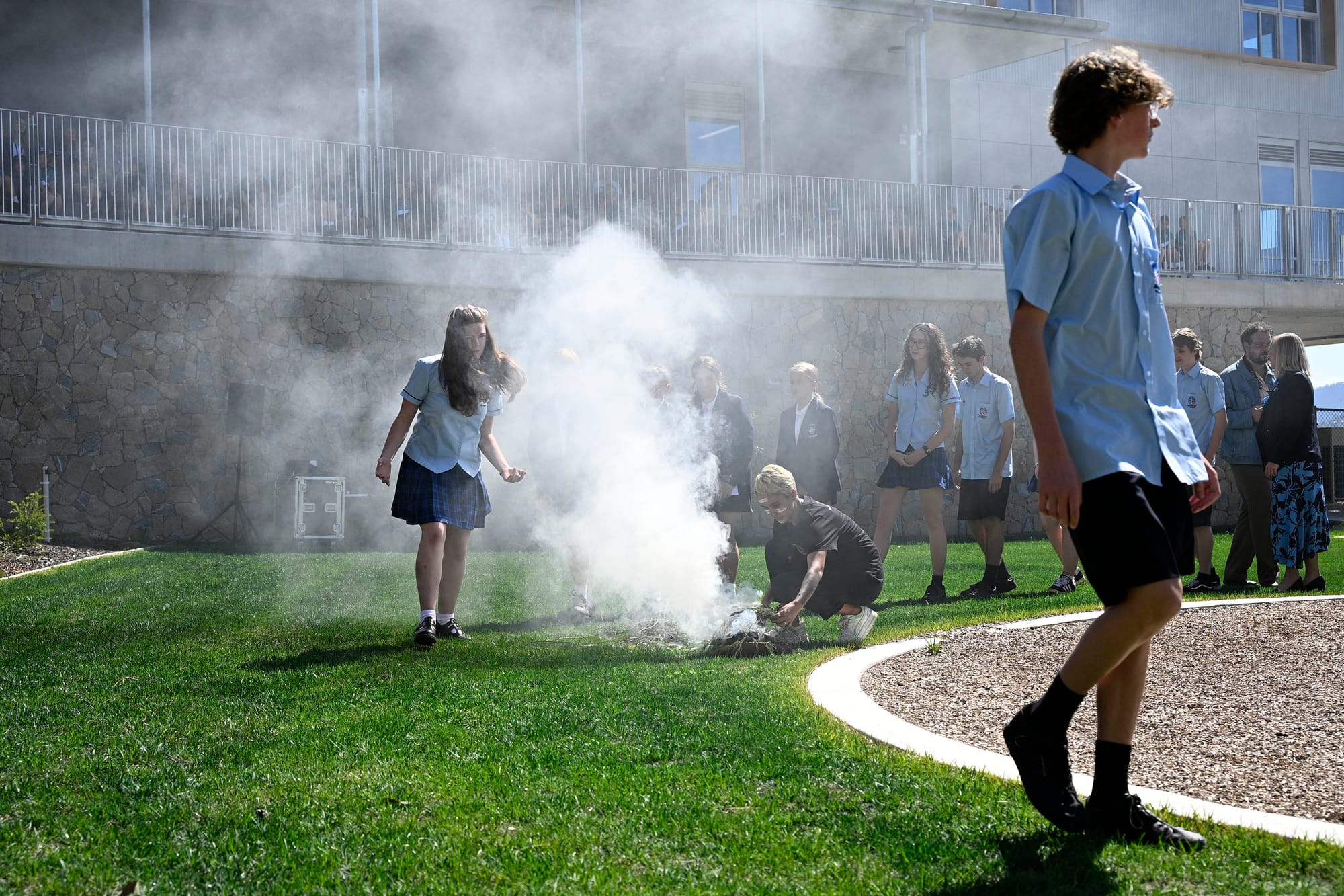 Students partaking in the the smoking ceremony.