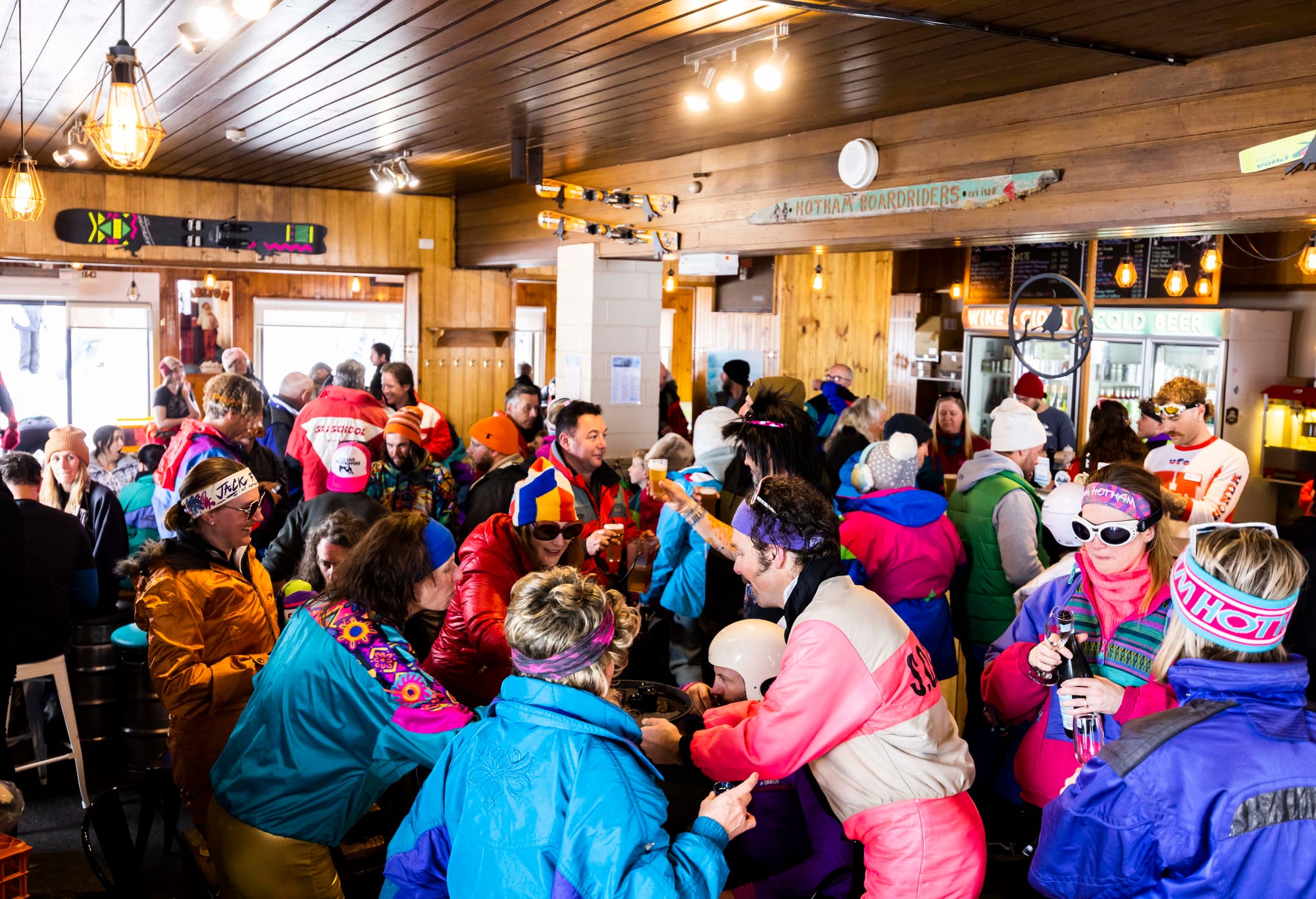 FLURO COMEBACK: Mt Hotham's Retro Day last year saw plenty of bright onesies, and this year's event on 13 September is certain to be similar. PHOTO: Vail Resorts