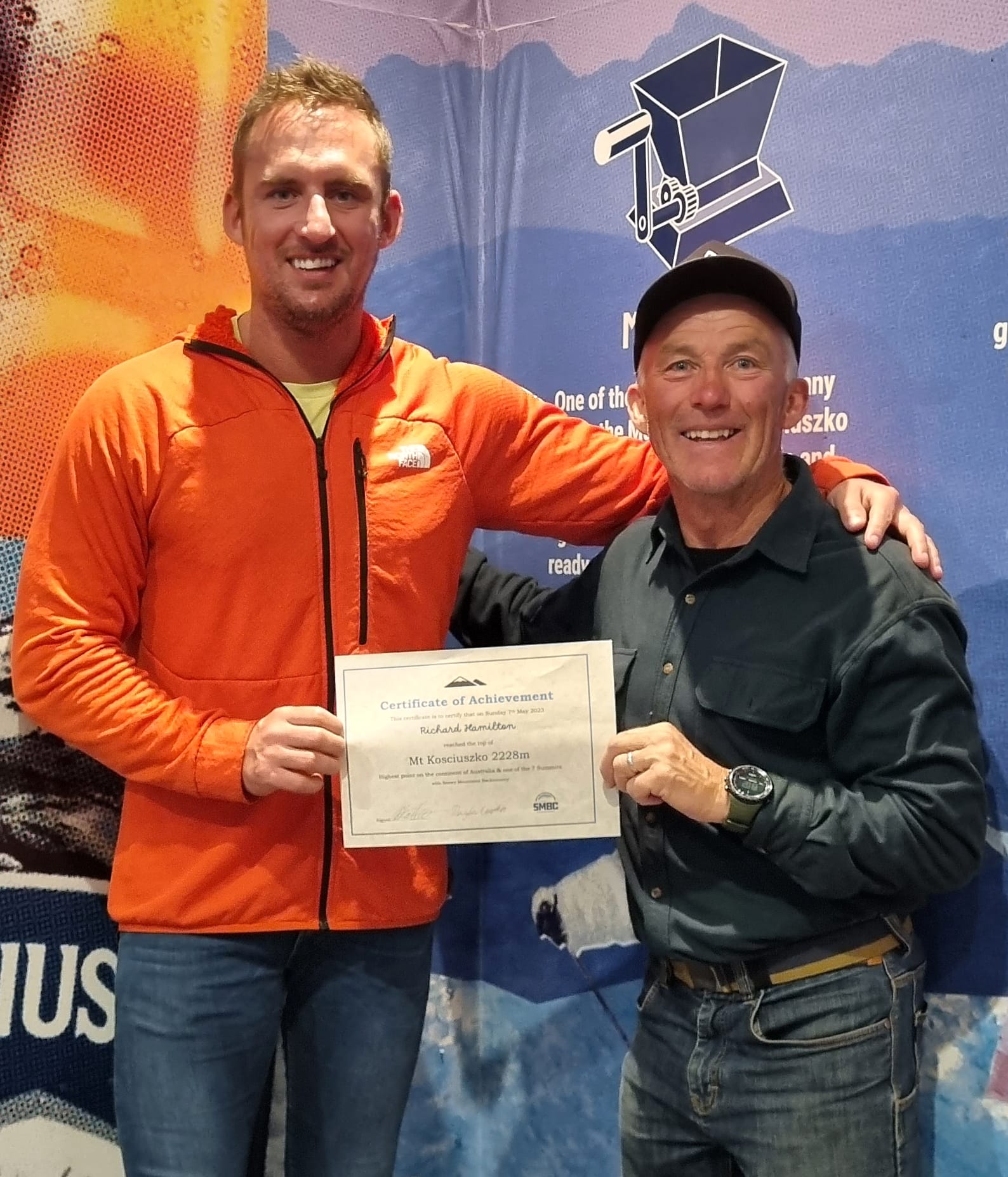 Richard receives his 'Climbed Mt Kosciuszko' certificate from Doug Chatten.