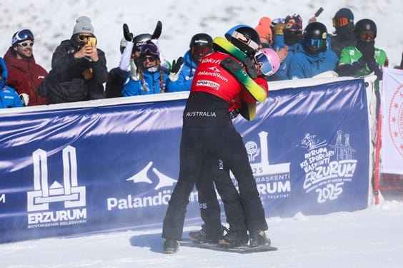 Bolton and Baff celebrate after taking out gold in the pairs snowboarding.