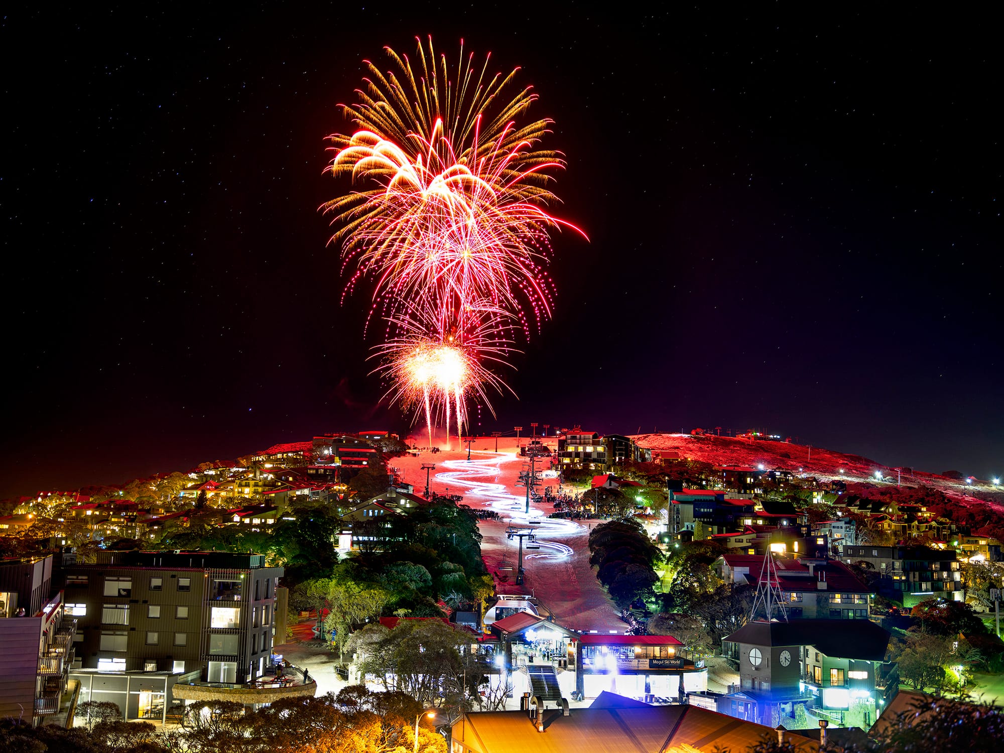 Mt Buller celebrates 100 years with 100 skiers in torchlight descent Post image